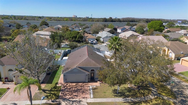 birds eye view of property with a residential view