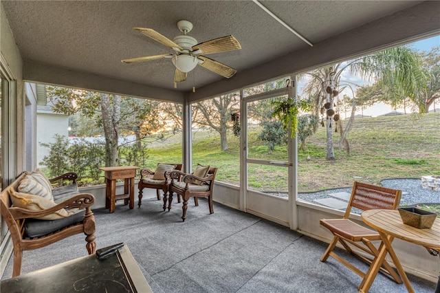 sunroom / solarium with ceiling fan