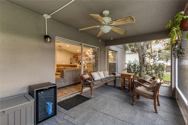 sunroom with beverage cooler and ceiling fan