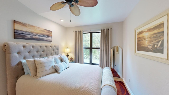 bedroom with ceiling fan and hardwood / wood-style floors