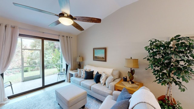 tiled living room featuring ceiling fan and vaulted ceiling