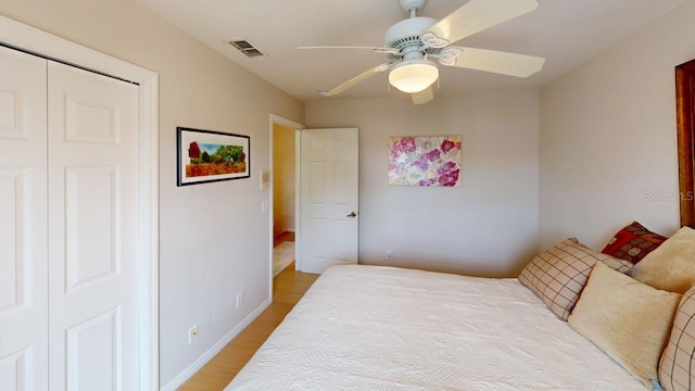 bedroom featuring wood-type flooring and ceiling fan