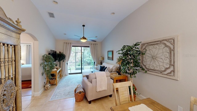 living room featuring light tile patterned flooring, ceiling fan, and high vaulted ceiling