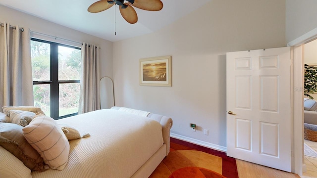 bedroom featuring hardwood / wood-style floors and ceiling fan