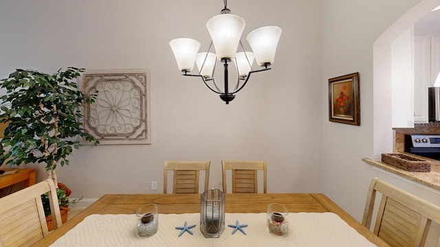 dining space featuring a chandelier