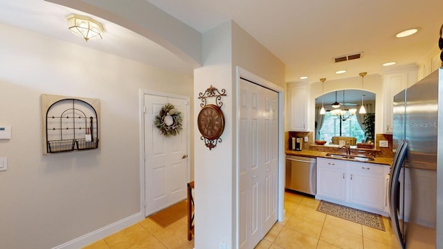 interior space with sink and light tile patterned flooring