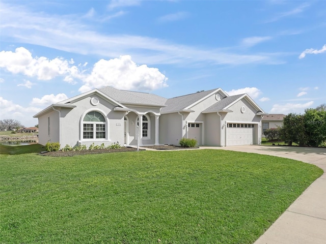 view of front of house with a garage, driveway, a front lawn, and stucco siding