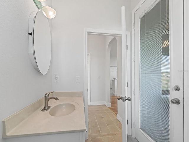 bathroom with baseboards and vanity