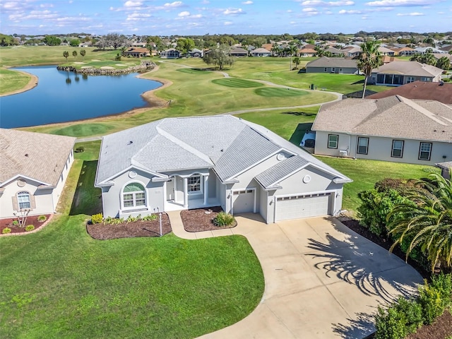 drone / aerial view featuring a water view and a residential view