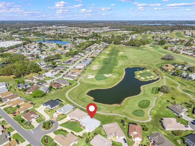 aerial view with a residential view, golf course view, and a water view