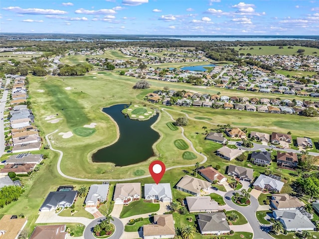 birds eye view of property with a residential view, view of golf course, and a water view