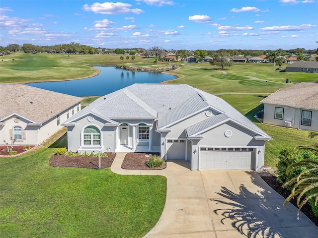 17899 SE 115th Cir, Summerfield, FL 34491 - view of front facade featuring a water view, a front yard, view of golf course, and driveway