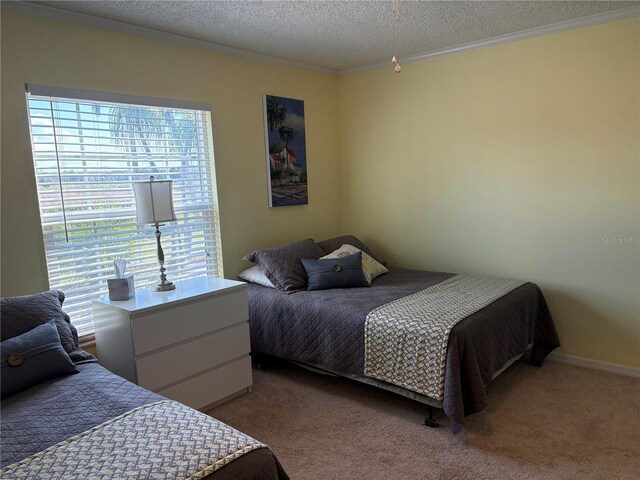 1152 Villa Ln Unit 104, Apopka, FL 32712 - carpeted bedroom featuring crown molding and a textured ceiling