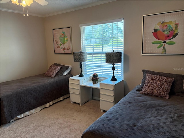 1152 Villa Ln Unit 104, Apopka, FL 32712 - bedroom featuring crown molding, light carpet, and ceiling fan