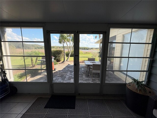 1152 Villa Ln Unit 104, Apopka, FL 32712 - entryway featuring dark tile patterned floors