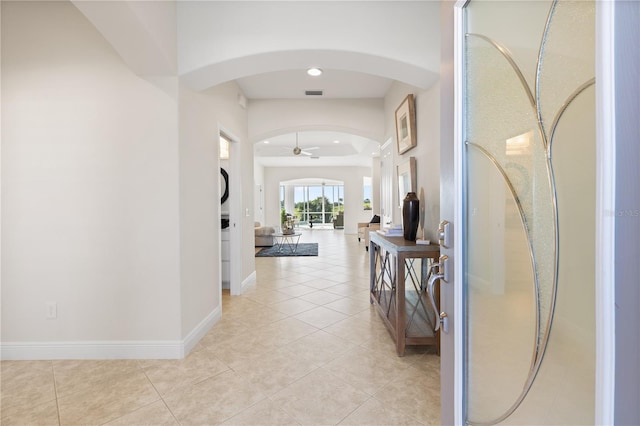 hall with light tile patterned flooring