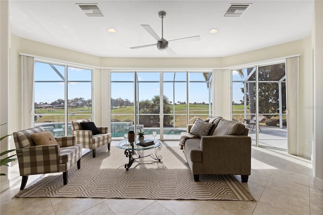 tiled living room featuring ceiling fan