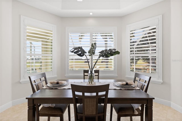 dining area featuring light tile patterned floors