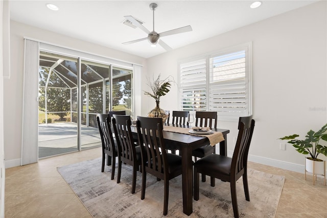 dining area featuring light tile patterned flooring, a wealth of natural light, and ceiling fan