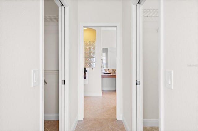 hallway featuring light tile patterned floors