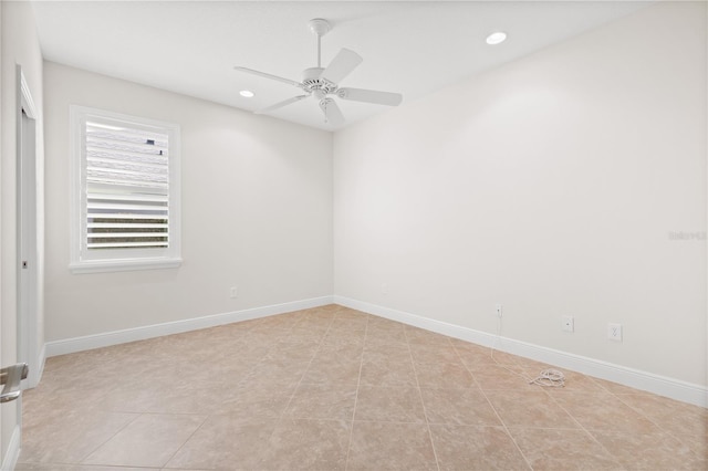 tiled empty room featuring ceiling fan