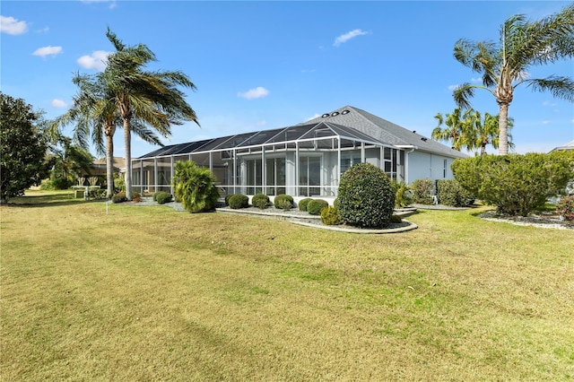 back of house with a lawn