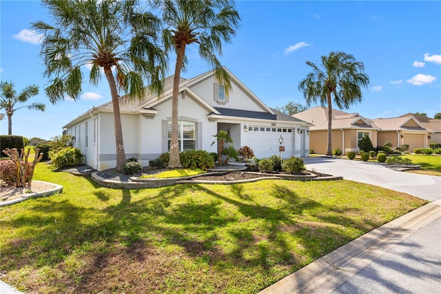 view of front of house featuring a garage and a front lawn