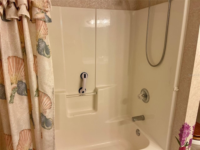 bathroom featuring shower / tub combo with curtain