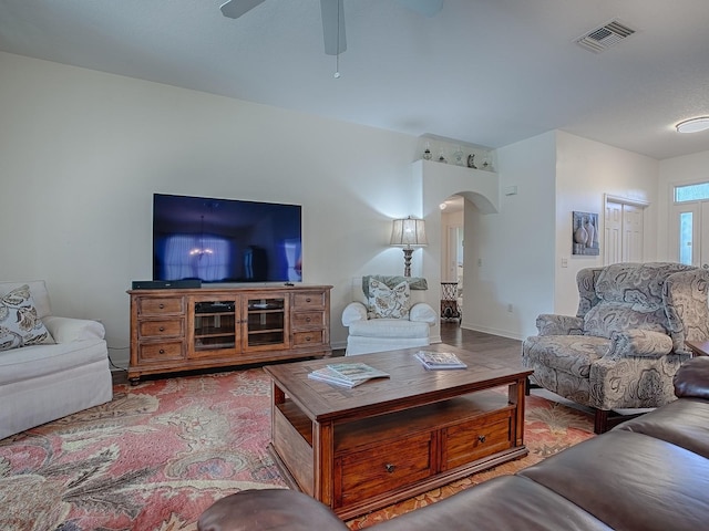 living room with hardwood / wood-style floors and ceiling fan