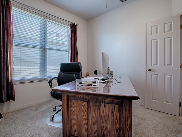 carpeted office space featuring plenty of natural light