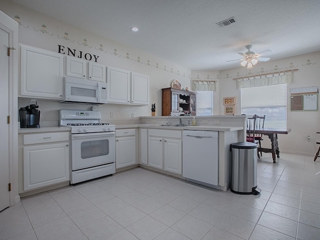 kitchen featuring ceiling fan, white cabinets, white appliances, and kitchen peninsula