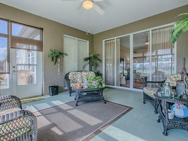 sunroom featuring ceiling fan