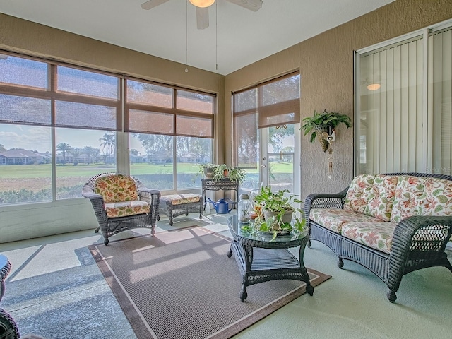 sunroom featuring ceiling fan