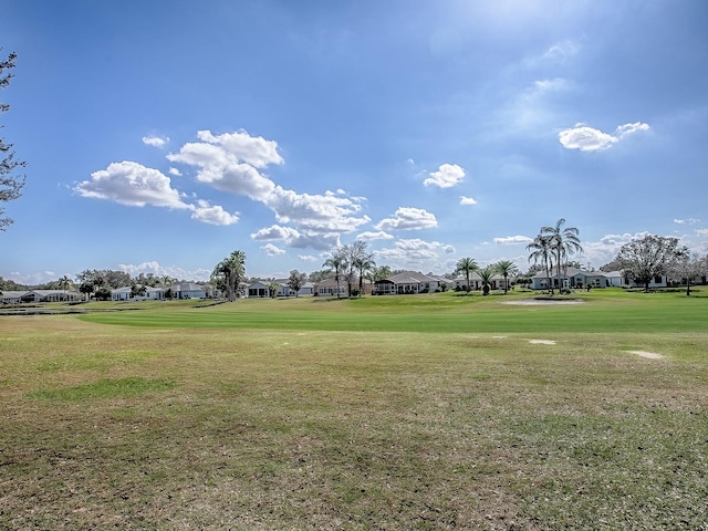 surrounding community with a lawn