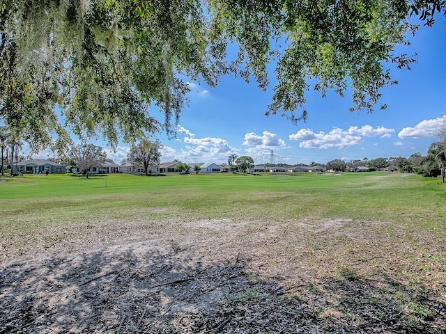 view of property's community featuring a yard