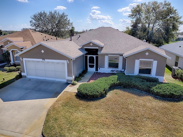 single story home with central AC unit, a garage, and a front yard