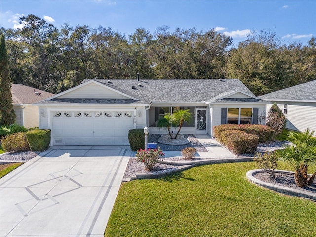 single story home with a garage and a front yard