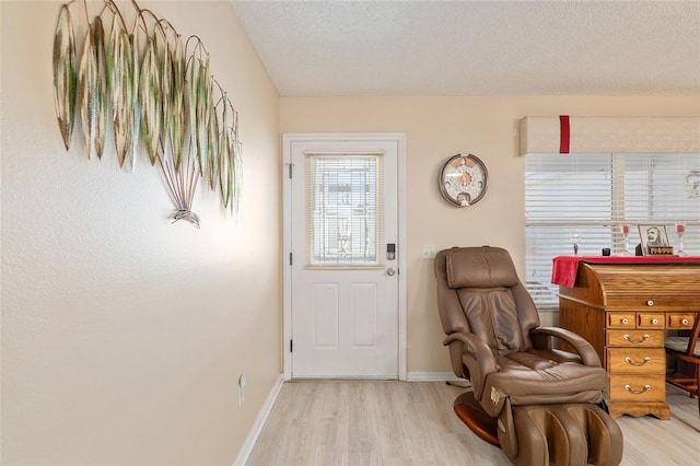 8373 SE 177th Bartram Loop, The Villages, FL 32162 - interior space featuring a textured ceiling and light hardwood / wood-style flooring