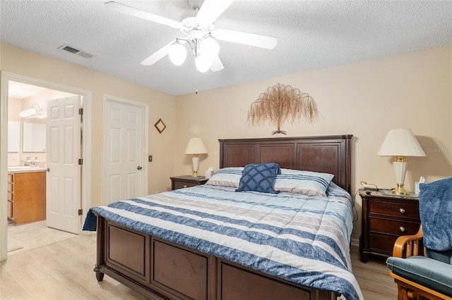 8373 SE 177th Bartram Loop, The Villages, FL 32162 - bedroom with ceiling fan, light hardwood / wood-style floors, and a textured ceiling