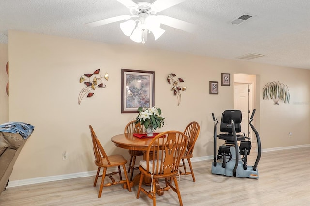 8373 SE 177th Bartram Loop, The Villages, FL 32162 - dining space featuring ceiling fan, light hardwood / wood-style flooring, and a textured ceiling