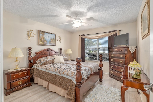 8373 SE 177th Bartram Loop, The Villages, FL 32162 - bedroom featuring ceiling fan, light hardwood / wood-style flooring, and a textured ceiling