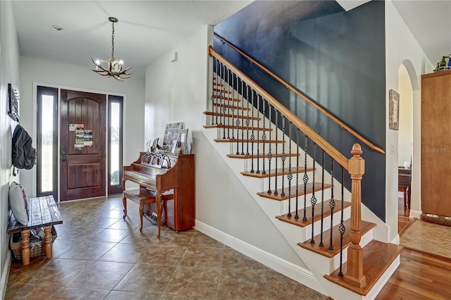 entryway with an inviting chandelier