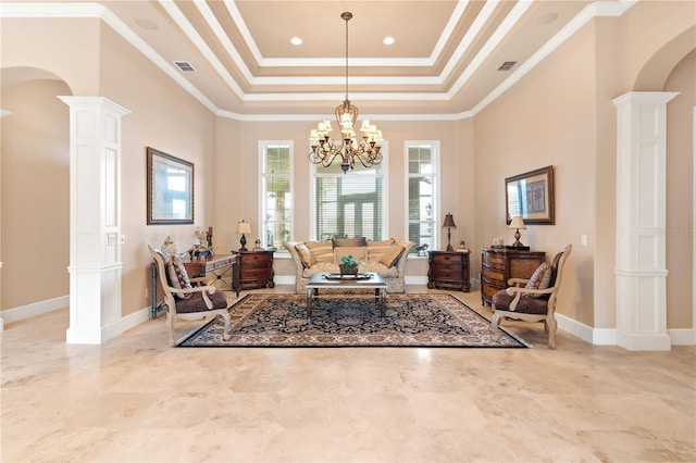 living area with ornate columns, ornamental molding, a raised ceiling, and an inviting chandelier