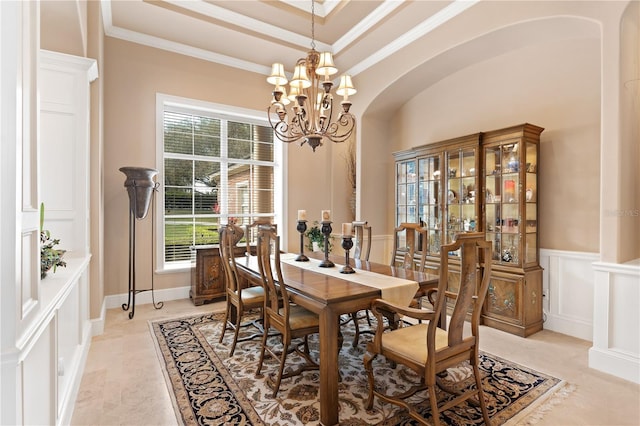 dining space featuring a notable chandelier and ornamental molding