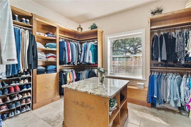 walk in closet featuring light tile patterned floors