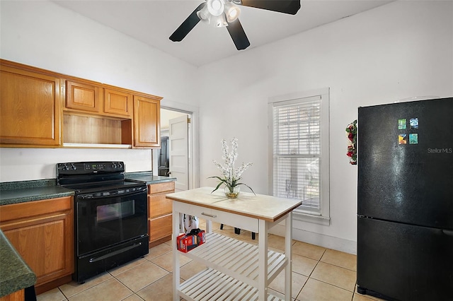 kitchen featuring black appliances, ceiling fan, and light tile patterned flooring