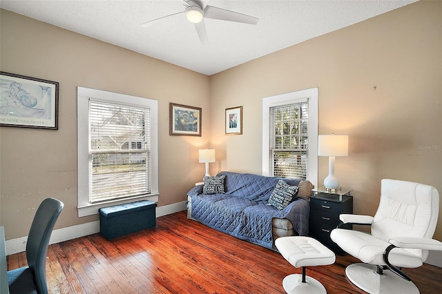 interior space featuring ceiling fan, dark hardwood / wood-style floors, and a textured ceiling