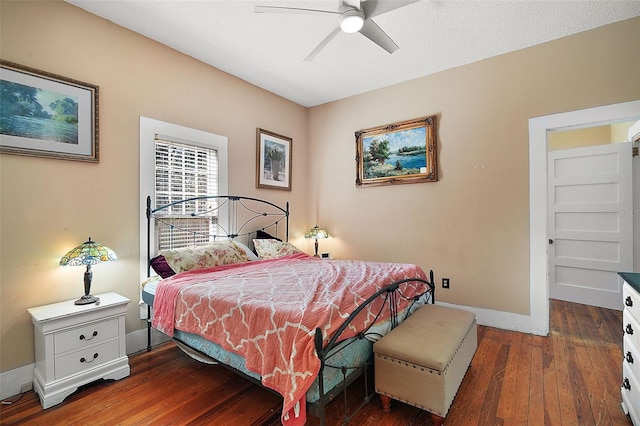 bedroom with ceiling fan and dark hardwood / wood-style flooring