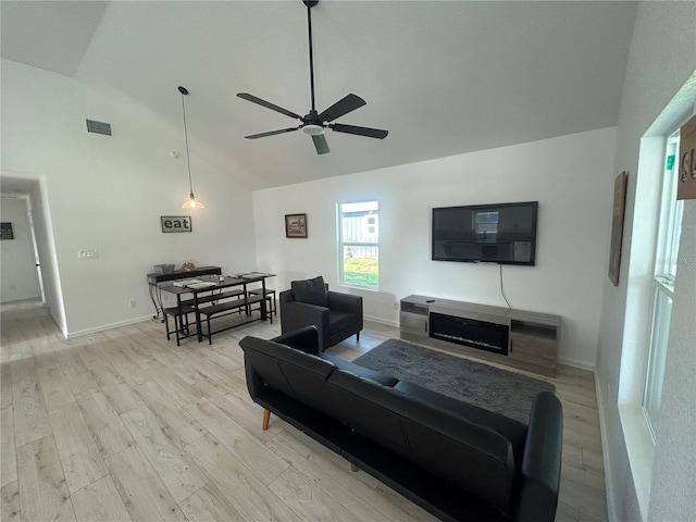 654 NW 9th Ave, Webster, FL 33597 - living area with ceiling fan, light wood-type flooring, and high vaulted ceiling