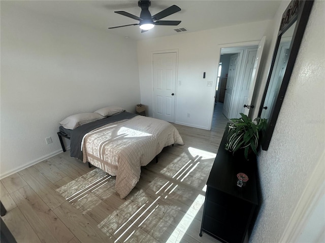 654 NW 9th Ave, Webster, FL 33597 - bedroom with wood finished floors and ceiling fan